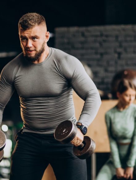 Couple training together at the gym