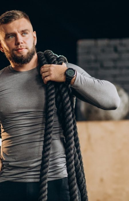 Handsome man exercising at the gym